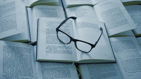 Books with reading glasses